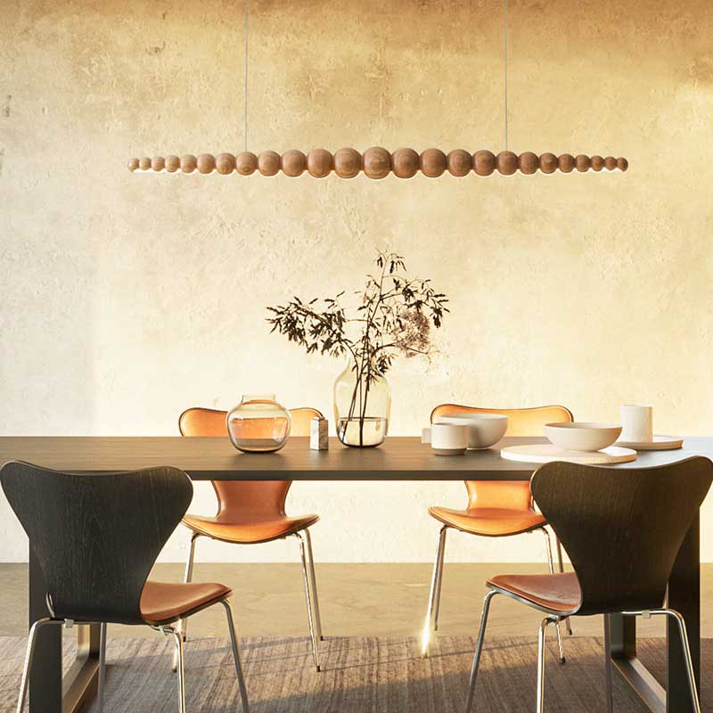 Nimbus log wood chandelier above the dining table.